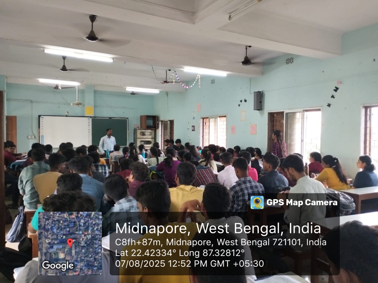 Students in a focused learning session from the field